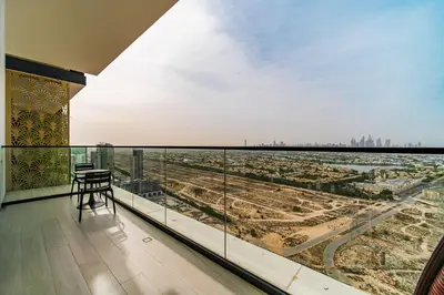 a balcony with a view of a city at SettlerHomes - JVC Skyline Views - Pool & Gym in Dubai