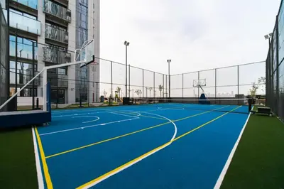a basketball court in the middle of a building at SettlerHomes - Chic Cloud B - Pool, Gym & Court in Dubai