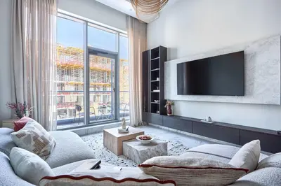 a living room with a couch and a tv at Frank Porter - J One Tower in Dubai