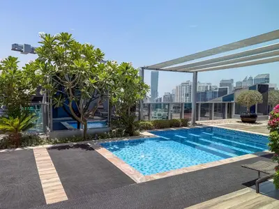 a swimming pool on top of a building at Frank Porter - J One Tower in Dubai