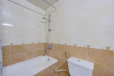 a bathroom with a toilet and a bath tub at Dreamy heaven Spacious 2BR Apt with marina view in Dubai