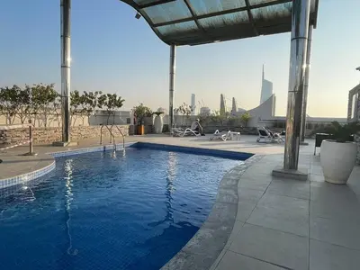 a swimming pool on the roof of a building at Dreamy heaven Spacious 2BR Apt with marina view in Dubai