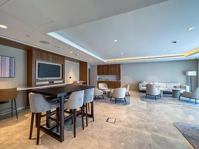 a hotel room with a table and chairs at One Bedroom Apartment with Balcony in Act One Act Two, Downtown in Dubai
