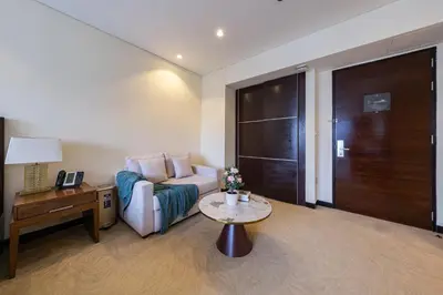 a living room with a couch and a table at Marina View Studio with Balcony in Dubai