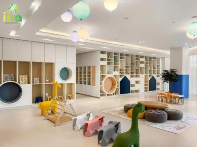 a childrens play room with dinosaurs and a table and chairs at INA HOMES - Modren 2 Bedroom Apartment with Full Burj Khalifa View in Dubai