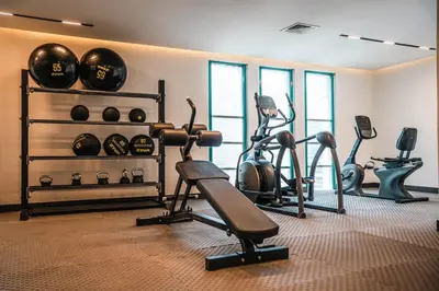 a gym with several exercise bikes and exercise balls at Studio in central location near the Metro in Dubai