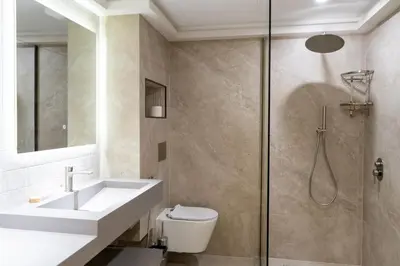 a bathroom with a shower and a sink and a toilet at Werova - Luxury 2BR Apartment w Breathtaking View in Dubai