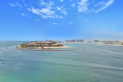 an island in the middle of a body of water at Grand Bleu by Elie Saab Residency, Private Beach - Dubai Harbour - 2BR in Dubai