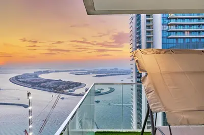 a view of the ocean from a balcony of a building at PS5- Designer 2BR with Private Beach, Dubai Eye, Palm in Dubai