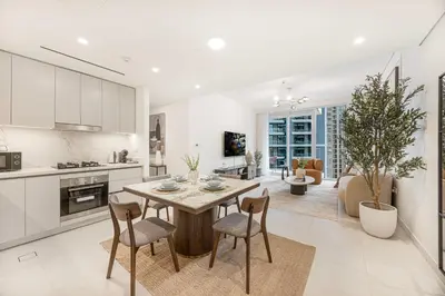 a kitchen and living room with a table and chairs at Seaside Stay at Beach Mansion with Private Beach in Dubai