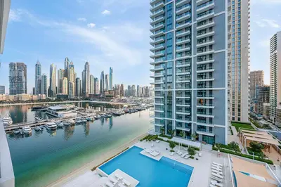 a view of a city with a river and buildings at Seaside Stay at Beach Mansion with Private Beach in Dubai