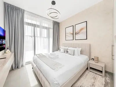 a white bedroom with a large bed and a window at Royal Vista 26 - 4BR Villa at Arabian Ranches III in Nadd Shubayḩ
