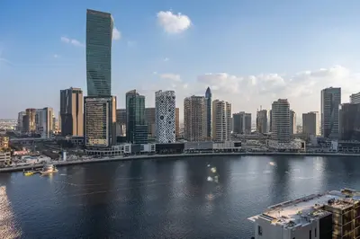 a view of a city with a river and buildings at Stayshort - 1 Bedroom in Business Bay with Canal Views that Sleeps 4 in Dubai