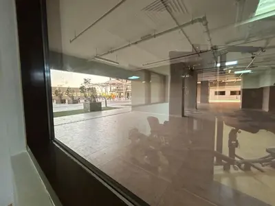 a window of a building with a table and chairs at Mavies Estate Al Jaddaf by Marriot in Dubai