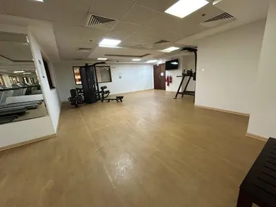 an empty room with a wooden floor in a building at Mavies Estate Al Jaddaf by Marriot in Dubai