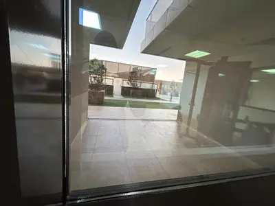 an open glass door of a building with a hallway at Mavies Estate Al Jaddaf by Marriot in Dubai