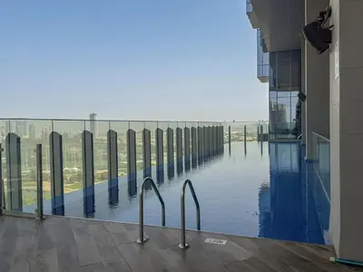 a view of a swimming pool from a building at Balcony with City View 2 Bedroom - JLT Dubai Close to Metro & Marina by Heaven Crest Vacation Homes in Dubai