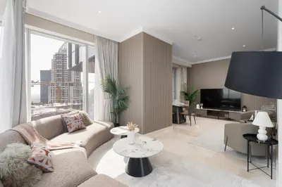 a living room with a couch and a tv at Balcony with City View 2 Bedroom - JLT Dubai Close to Metro & Marina by Heaven Crest Vacation Homes in Dubai