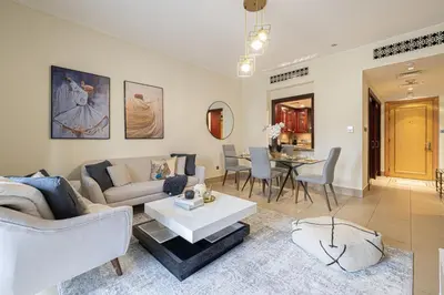 a living room with a couch and a table at Dubai Icon Suite at Miska 2 in Dubai