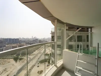 an office building balcony with a view of a city at Opalz Grandeur Escape 2BDR w Mini Pool-06 in Dubai