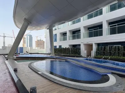 a swimming pool on the roof of a building at Opalz Grandeur Escape 2BDR w Mini Pool-06 in Dubai