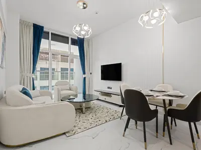 a living room with a couch and a table at Opalz Grandeur Escape 2BDR w Mini Pool-06 in Dubai