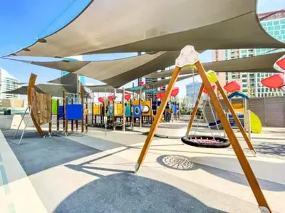 a playground with colorful playground equipment in a building at Vogue Downtown Mag 318 near Burj Khalifa and Dubai Mall, Studio Apartment with Balcony and City View, Access to all Amenities in Dubai