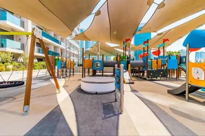 a playground with tables and chairs in a building at Vogue Downtown Mag 318 near Burj Khalifa and Dubai Mall, Studio Apartment with Balcony and City View, Access to all Amenities in Dubai