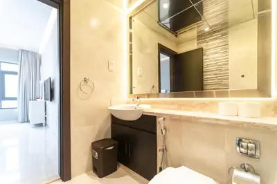 a bathroom with a sink and a mirror at Stunning 3BDR in Al Sidir Greens in Dubai