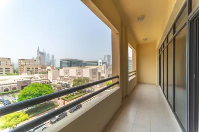 a balcony with a view of a city at Stunning 3BDR in Al Sidir Greens in Dubai