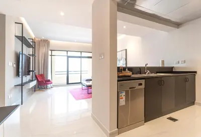 a kitchen with a sink and a counter at Stunning 3BDR in Al Sidir Greens in Dubai