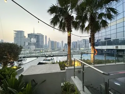 a view of a city with a river and palm trees at PNB Living - Luxury 2 Bedroom Apartment with High Floor - DAMAC Towers by Paramount Tower D in Dubai