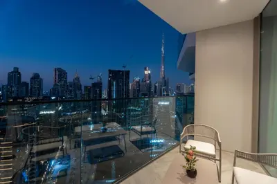 a balcony with a view of a city skyline at GuestReady - 1BR l Burj Khalifa View in Dubai