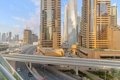 a highway in a city with many tall buildings at Silkhaus Studio Stay in Dubai Marina - Botanica in Dubai