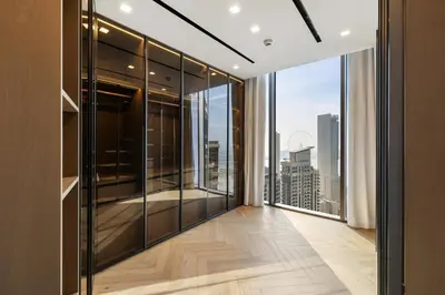 a room with a balcony with a view of the city at LIV Marina, Dubai Marina - 4 Bedroom Penthouse with Panoramic Views - Allsopp & Allsopp in Dubai