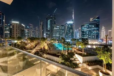 a view of a city at night at GuestReady - Premium Location | Studio | Pool View in Dubai