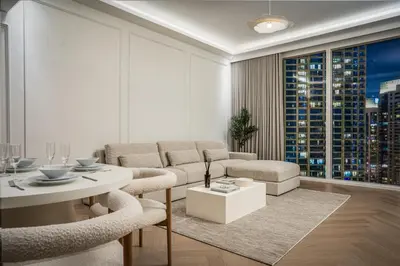 a living room with a couch and a table at Daniels 2BR at Creek Gate with Canal View in Dubai