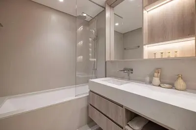a white bathroom with a sink and a shower at Mahogany 26 - 4BR 9PAX - Dubai Hills Park Peaceful in Dubai