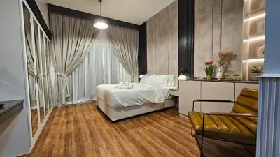 a bedroom with a bed and a couch in a room at Bella-Rose-Fully Furnished Cozy High Floor Amazing View in Dubai