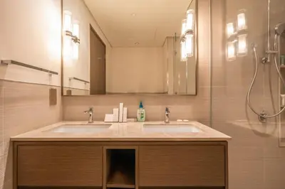 a bathroom with a sink and a shower at Dream Apartment with Burj Khalifa & Fountain Views in Dubai