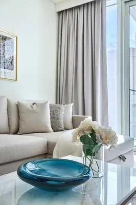 a living room with a couch and a glass table at Frank Porter - Beach Mansion in Dubai