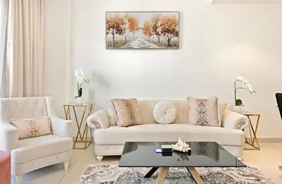a living room with a couch and a coffee table at Bloomfields Tranquil 2BR in Dania 4 in Dubai