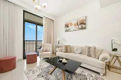 a living room with a couch and a table at Bloomfields Tranquil 2BR in Dania 4 in Dubai