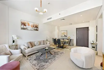 a living room with a couch and a table at Bloomfields Tranquil 2BR in Dania 4 in Dubai
