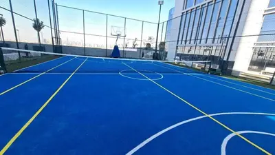 an empty tennis court in a building at Cloud Tower 1br With Parking Pool Gym & Sports Facilities in Dubai