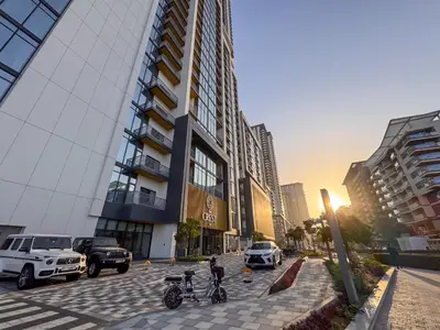a group of motorcycles parked in a parking lot next to a building at 1BR plus Study Peaceful, Family-Friendly Community in Dubai