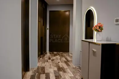 a hallway with a door and a vase of flowers at FENDI 2BR- 67 Floor Sea, Atlantis & Dubai Eye View in Dubai