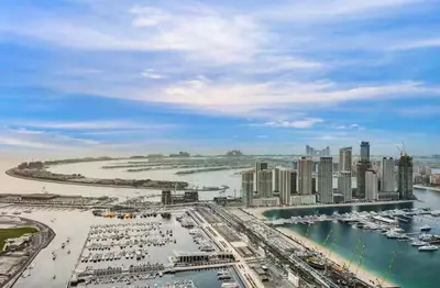 a view of a city with boats in the water at FENDI 2BR- 67 Floor Sea, Atlantis & Dubai Eye View in Dubai