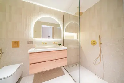 a bathroom with a shower and a sink and a toilet at Newly renovated, near the beach, with a Marina View in Dubai