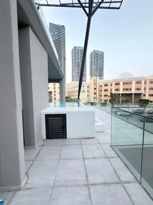a building with a fireplace in the middle of a city at Modern 2BR House , Pool , 3 Baths, Balconies in Dubai